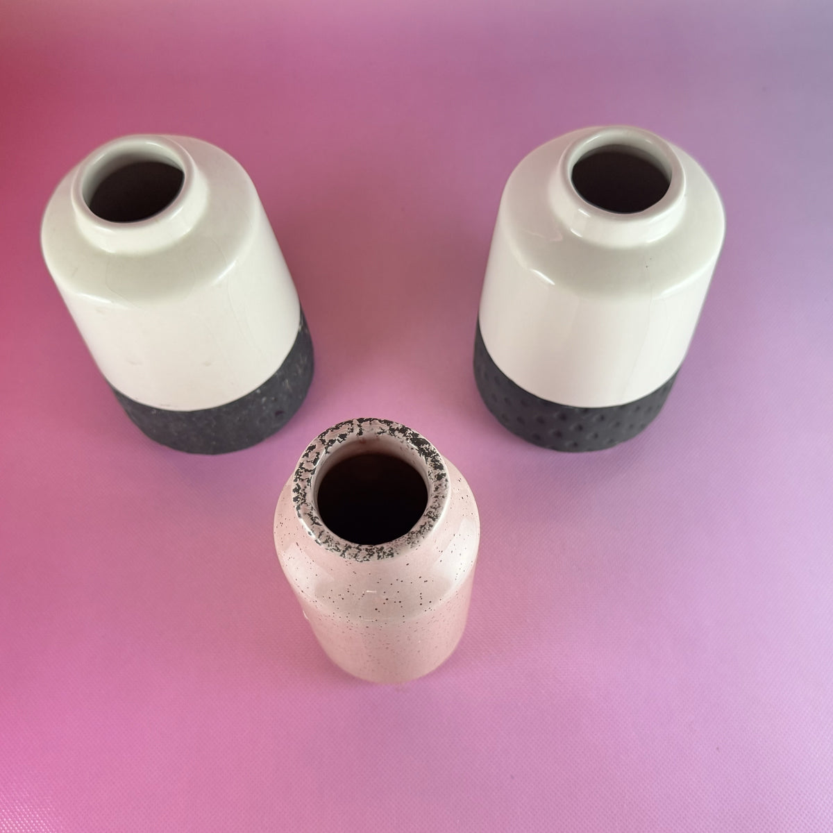 Pair Black and White Isaac Mizrahi Vases with Pink Speckled Bud Vase