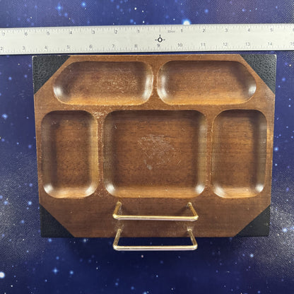A wooden compartment tray with a gold metal handle, shown on a blue starry background next to a ruler for scale.