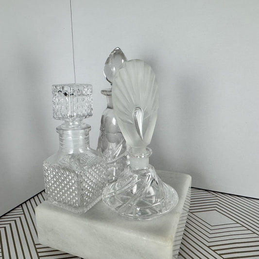 Trio of Crystal and Cut Glass Bottles and Stoppers