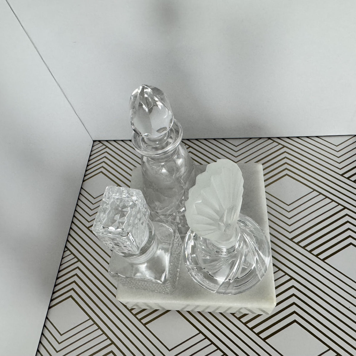 Trio of Crystal and Cut Glass Bottles and Stoppers