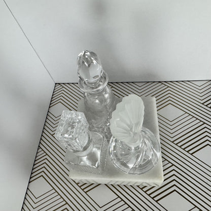 Trio of Crystal and Cut Glass Bottles and Stoppers
