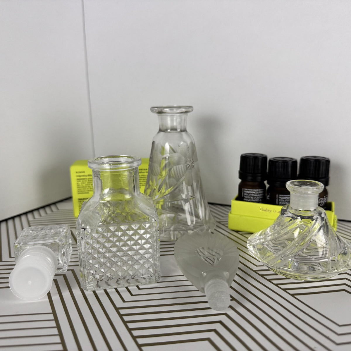 Trio of Crystal and Cut Glass Bottles and Stoppers