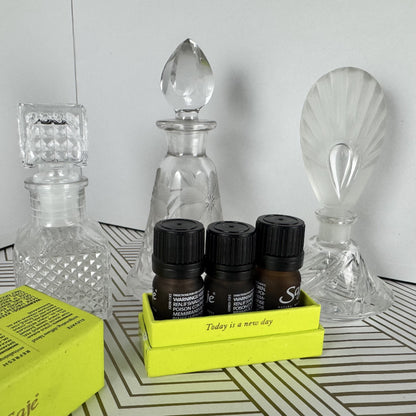 Trio of Crystal and Cut Glass Bottles and Stoppers