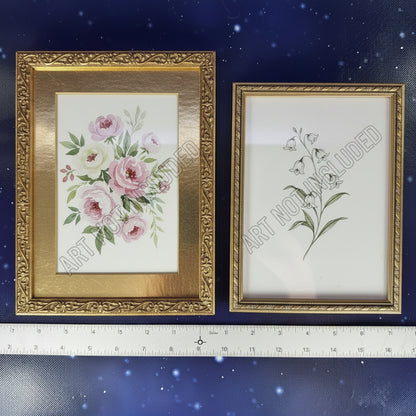 Two gold-framed certificates on a blue textured background with a ruler at the bottom.