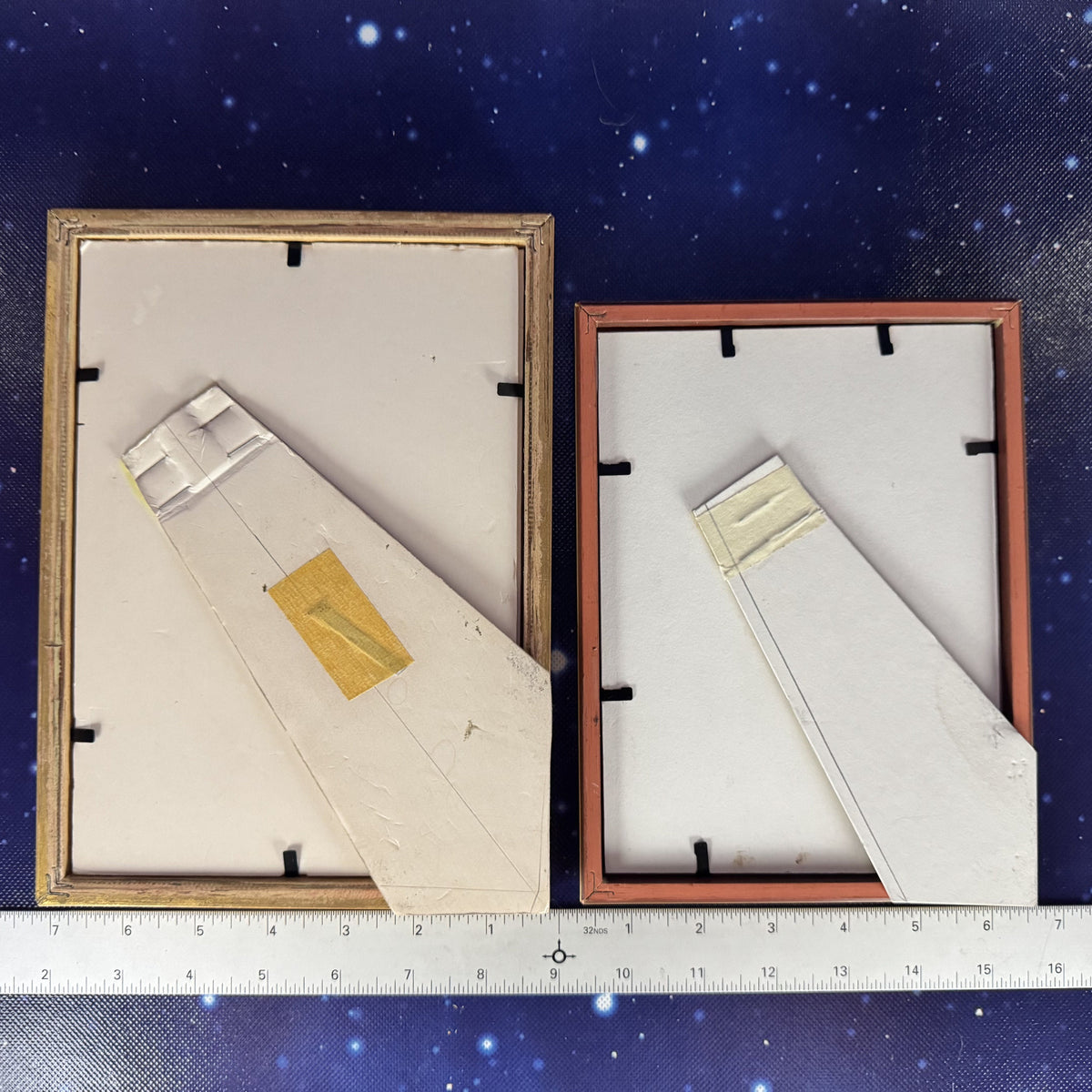Two framed items on a starry background with a ruler at the bottom.