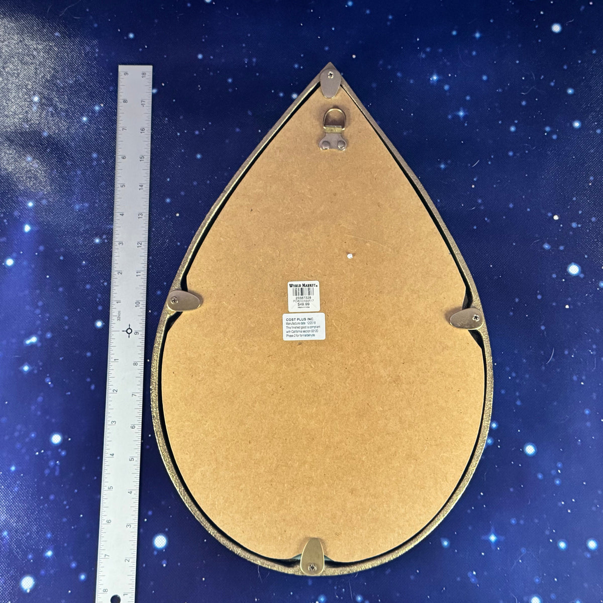 Teardrop-shaped object with a label on a starry background
