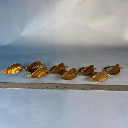 Set of Eight Brass Leaf Motif Napkin Rings