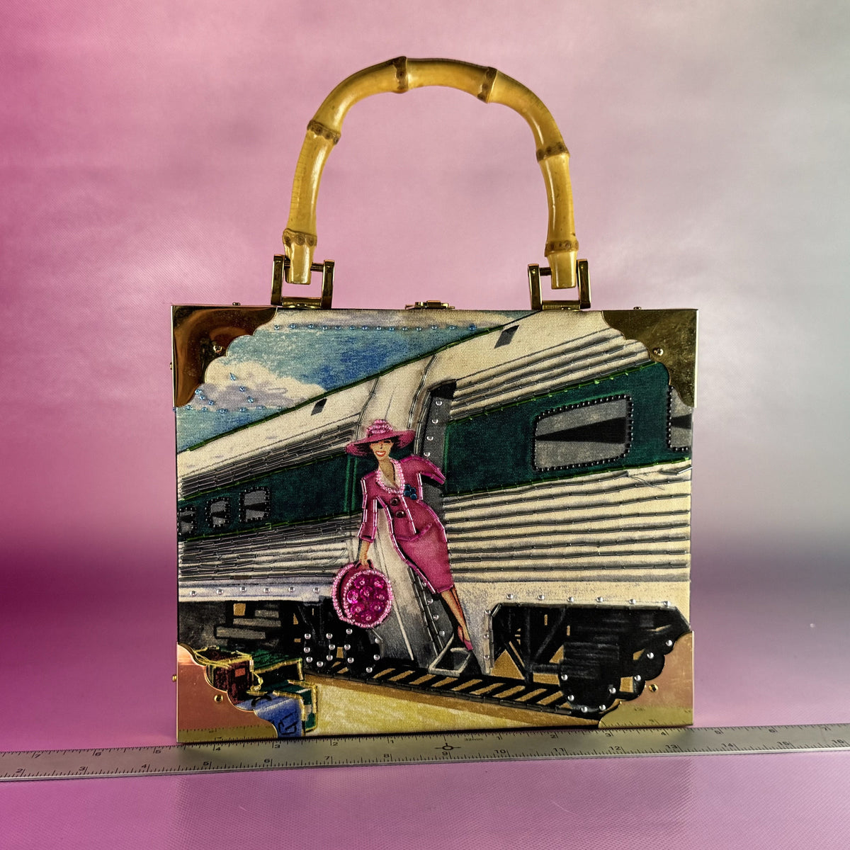 Handbag with a vintage train and woman design on a pink background