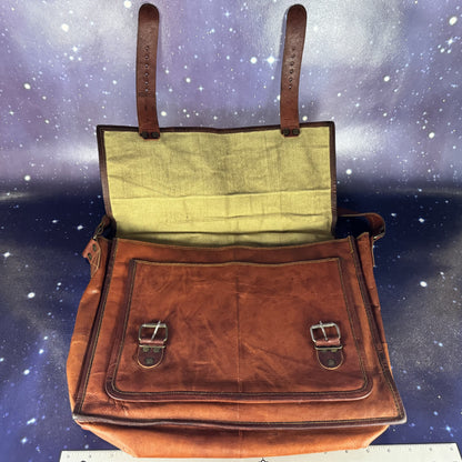 Brown leather bag with green interior against a starry space background