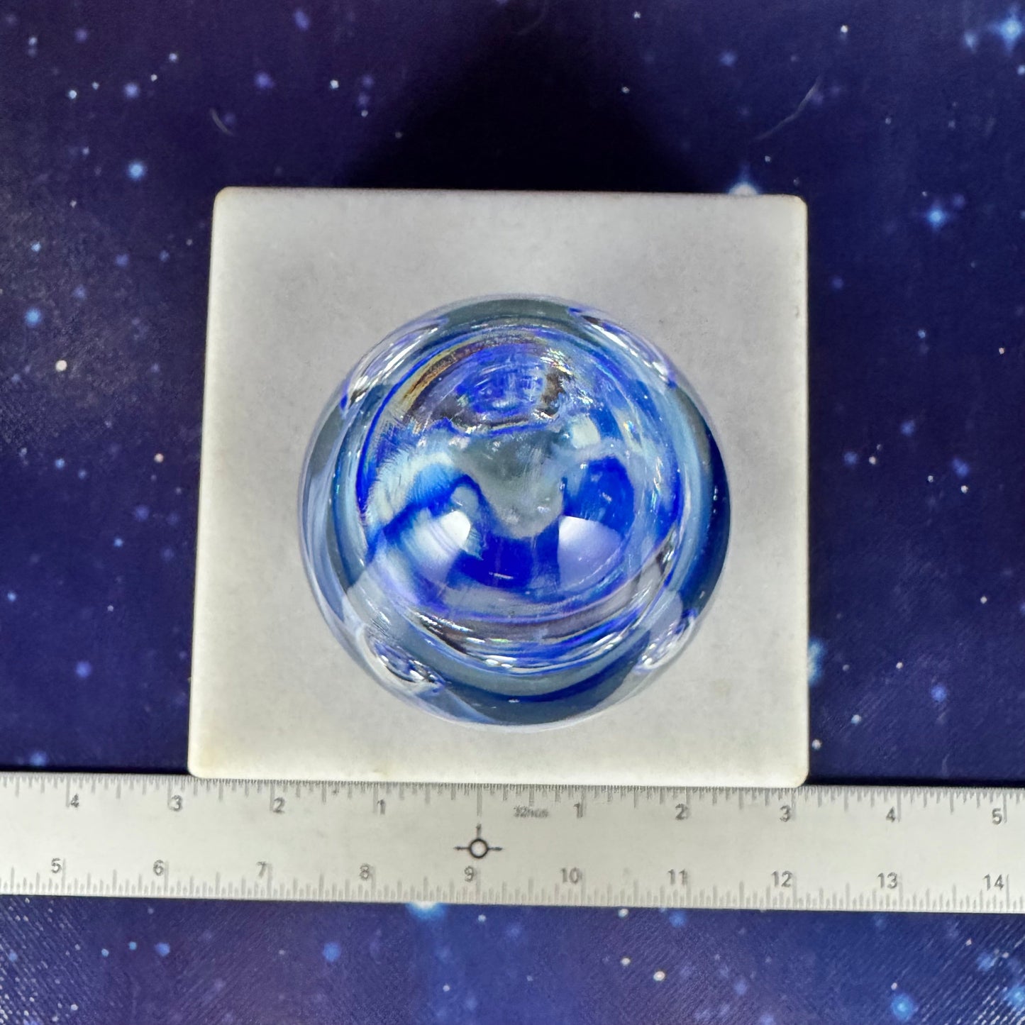 Egg-shaped Glass Paperweight with Blue Splash Design