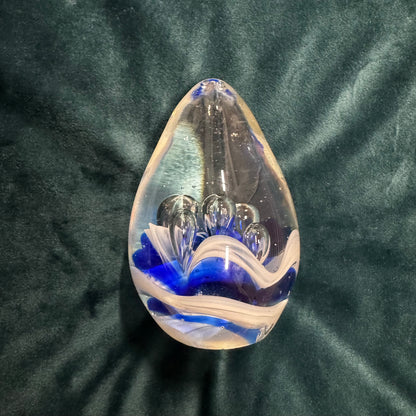 Egg-shaped Glass Paperweight with Blue Splash Design